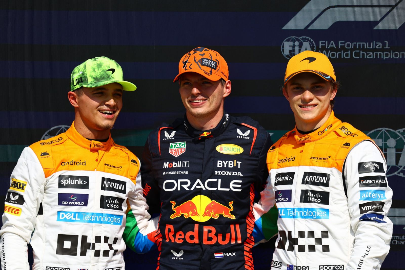 NORTHAMPTON, ENGLAND - JULY 08: Pole position qualifier Max Verstappen of the Netherlands and Oracle Red Bull Racing, Second placed qualifier Lando Norris of Great Britain and McLaren and Third placed qualifier Oscar Piastri of Australia and McLaren pose for a photo in parc ferme during qualifying ahead of the F1 Grand Prix of Great Britain at Silverstone Circuit on July 08, 2023 in Northampton, England. (Photo by Mark Thompson/Getty Images)